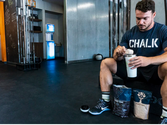 an athlete consuming protein supplement